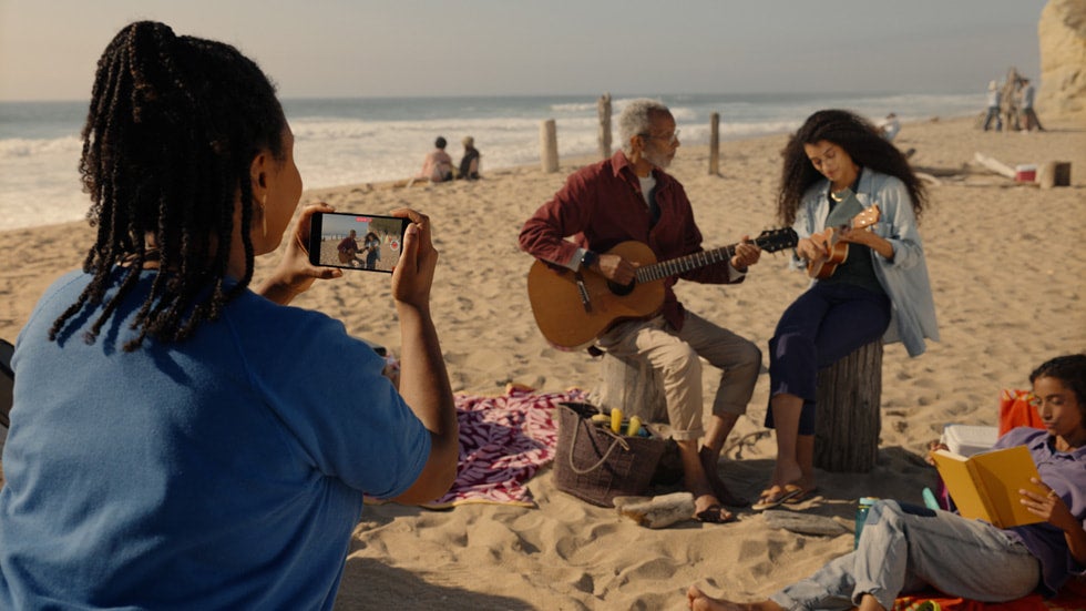 New iOS 17.2 feature Spatial Video footage being shot on beach (official Apple photo)