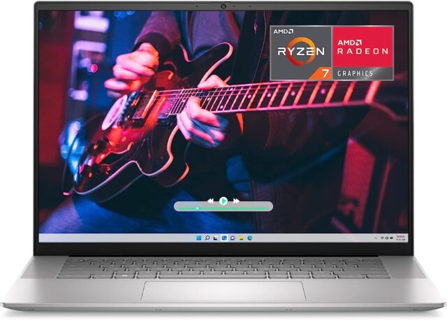 HP laptop with man playing guitar on screen
